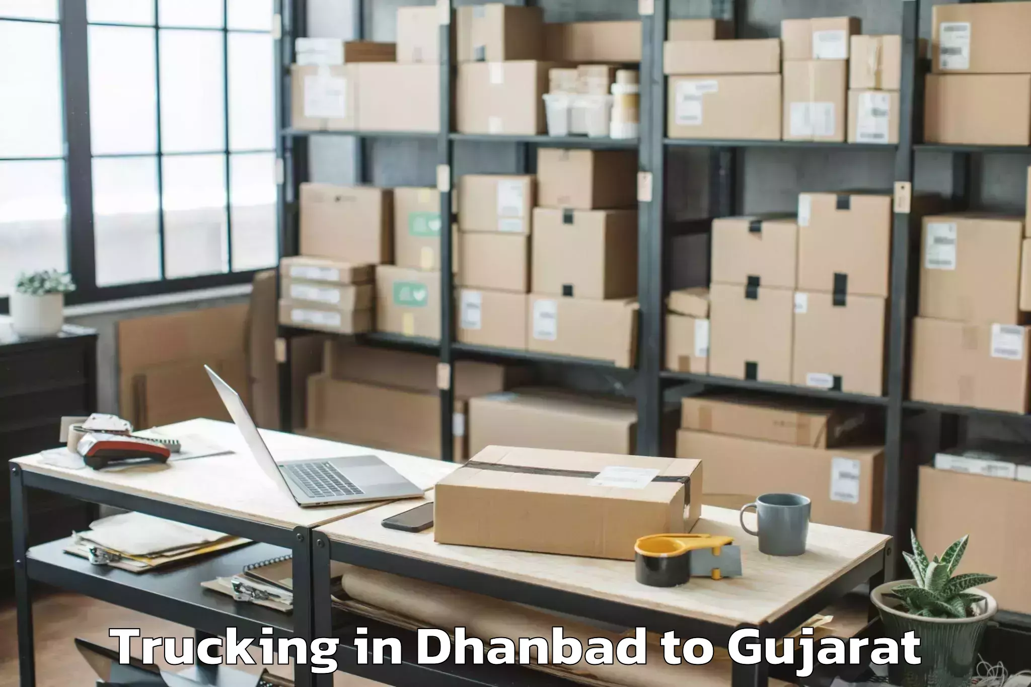 Top Dhanbad to Rajkot Airport Raj Trucking Available